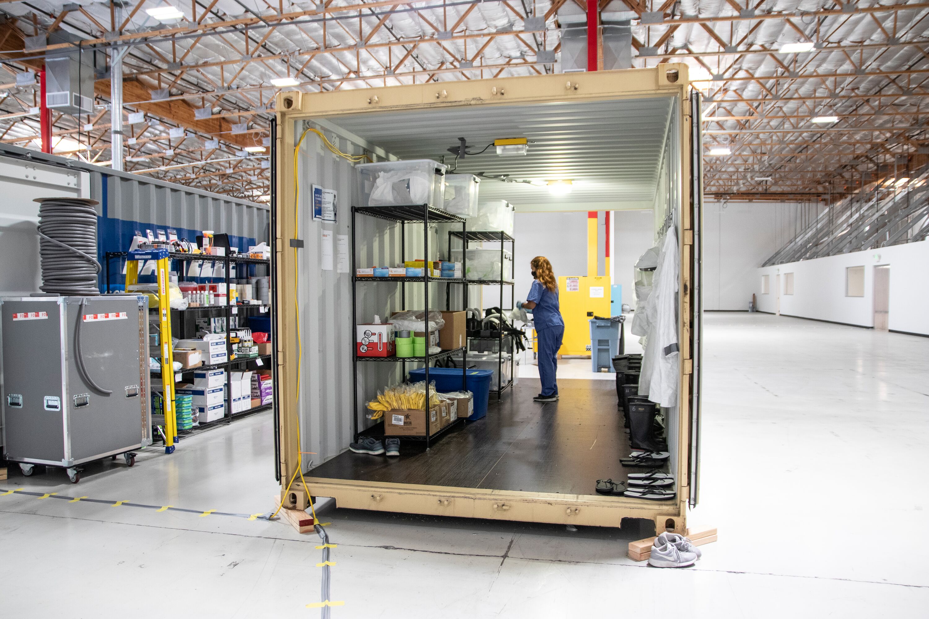 Woman works in a shipping container