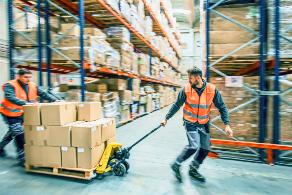 workers moving boxes in warehouse